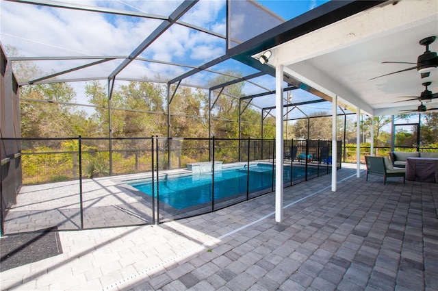 view of pool featuring ceiling fan, a lanai, outdoor lounge area, and a patio