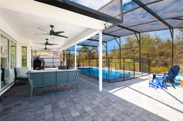 view of patio / terrace with ceiling fan, outdoor lounge area, and a lanai