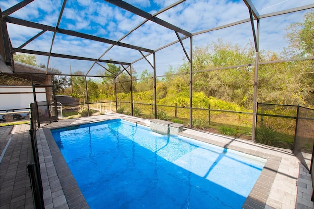 view of pool featuring a lanai and a patio