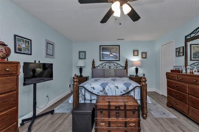 bedroom with ceiling fan and light hardwood / wood-style flooring