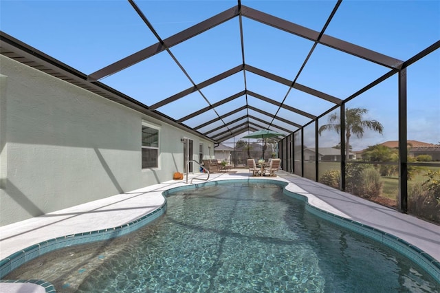 view of pool with a lanai and a patio area