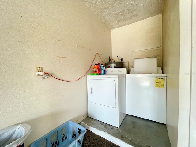 clothes washing area with washer and clothes dryer