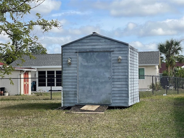 view of outdoor structure with a lawn