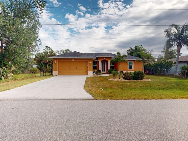 ranch-style house featuring a garage and a front lawn