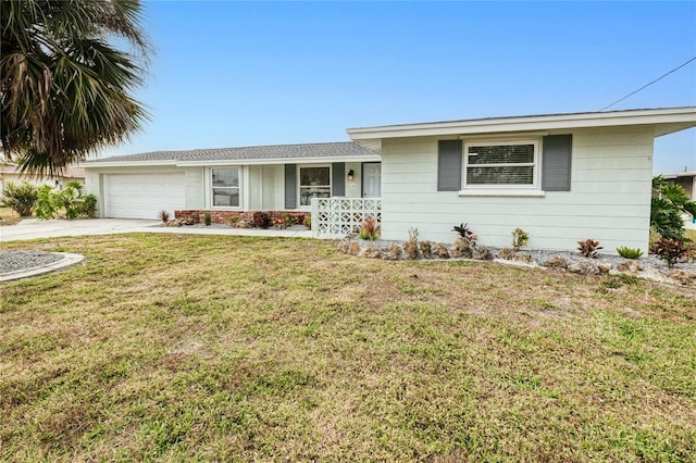 ranch-style house with a garage and a front lawn