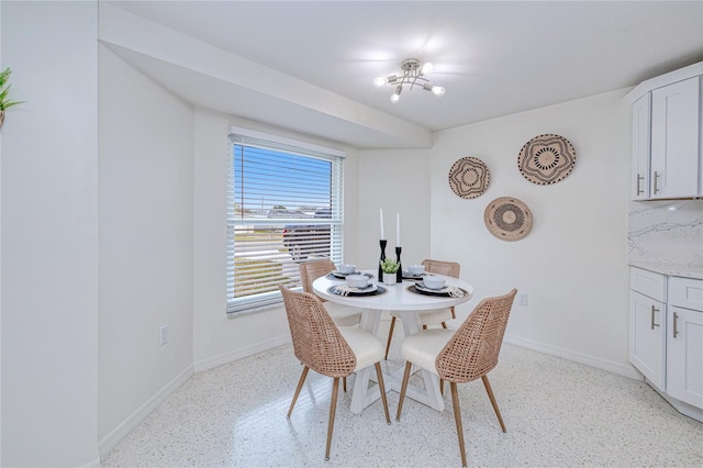 dining space with a notable chandelier