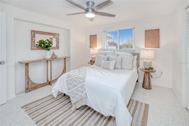 bedroom featuring ceiling fan and a closet