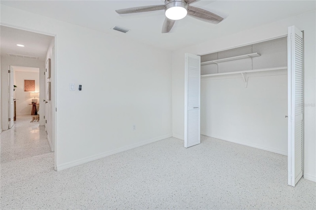 unfurnished bedroom with ceiling fan and a closet