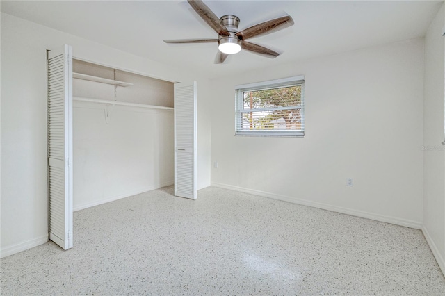 unfurnished bedroom with ceiling fan and a closet