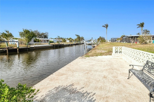 exterior space featuring a water view and a lawn