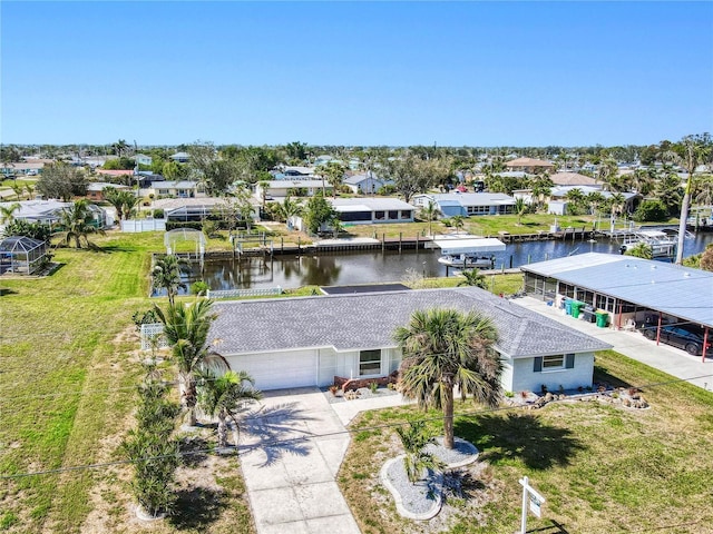 bird's eye view with a water view and a residential view