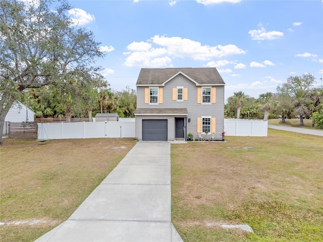 view of front of property featuring a front yard and a garage