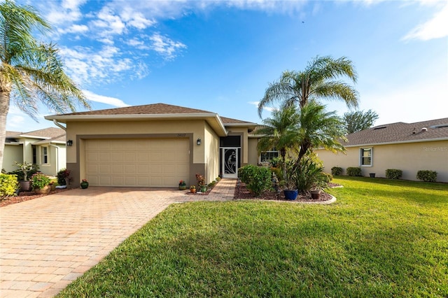 view of front of house featuring a front lawn and a garage