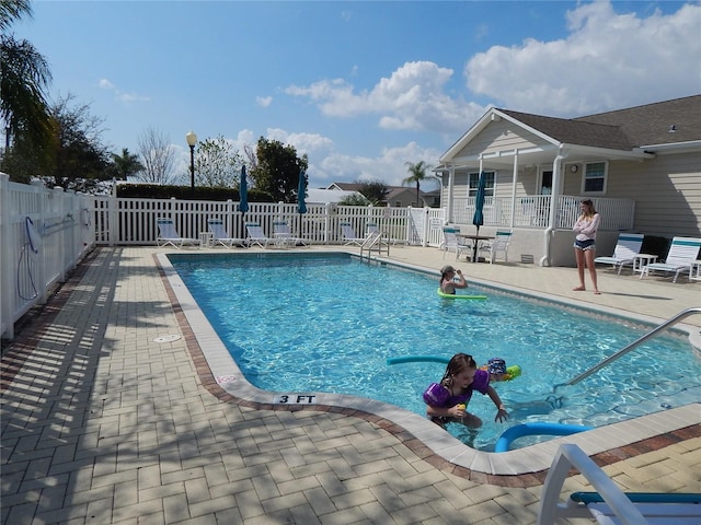 view of pool featuring a patio