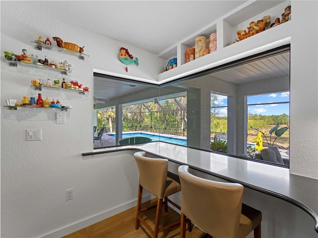 dining space featuring wood-type flooring