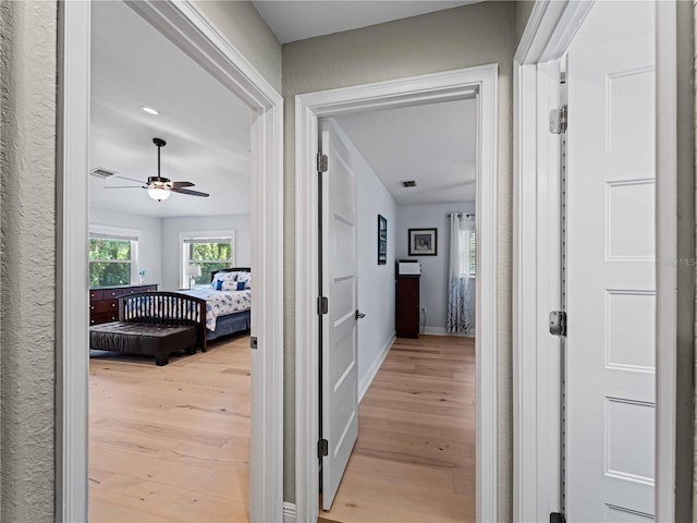 corridor featuring light wood-type flooring