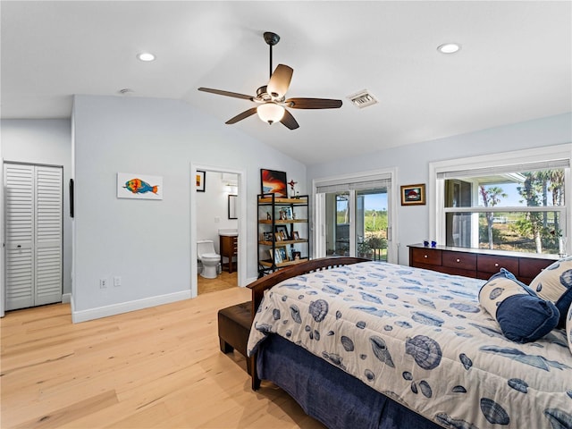 bedroom with ensuite bathroom, light hardwood / wood-style floors, ceiling fan, access to exterior, and vaulted ceiling