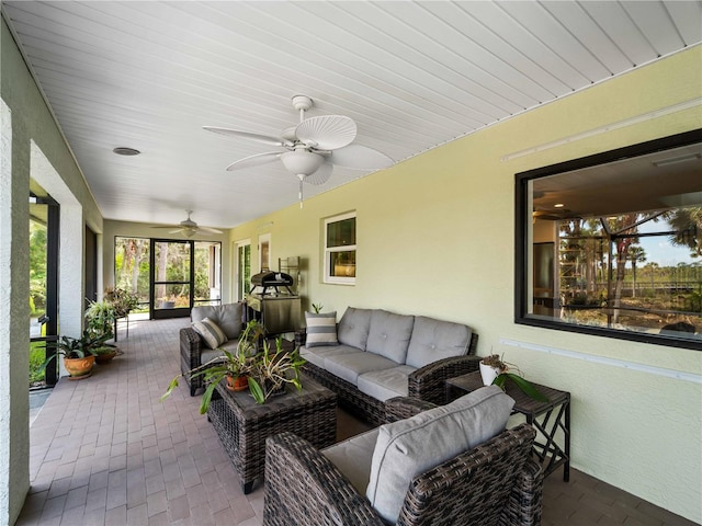 sunroom / solarium with ceiling fan