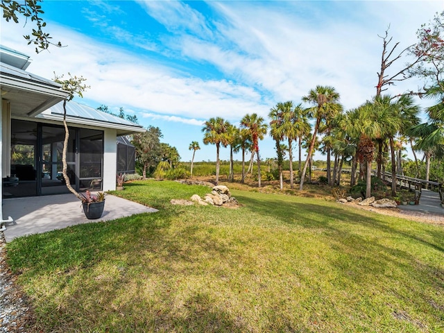 view of yard featuring a sunroom