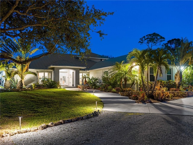 view of front of property with a yard