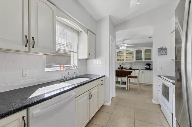 kitchen featuring white cabinets, decorative backsplash, sink, and white appliances