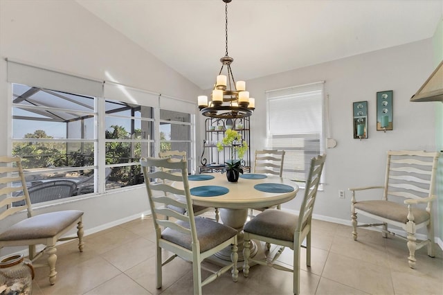 dining space with vaulted ceiling, plenty of natural light, and light tile patterned flooring