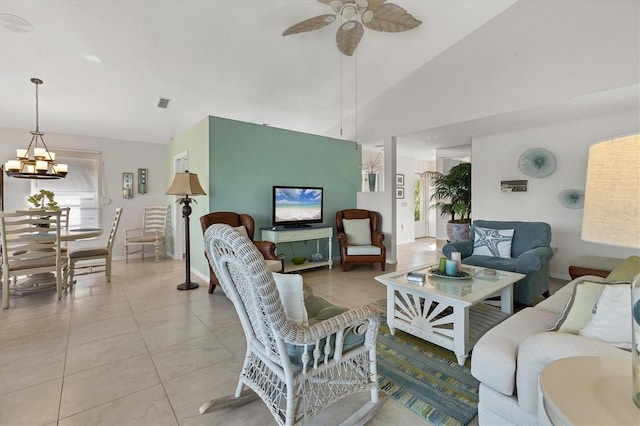 living room with ceiling fan with notable chandelier, light tile patterned floors, and lofted ceiling