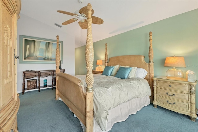 bedroom with lofted ceiling, ceiling fan, and dark colored carpet