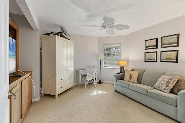 living room featuring ceiling fan and light colored carpet