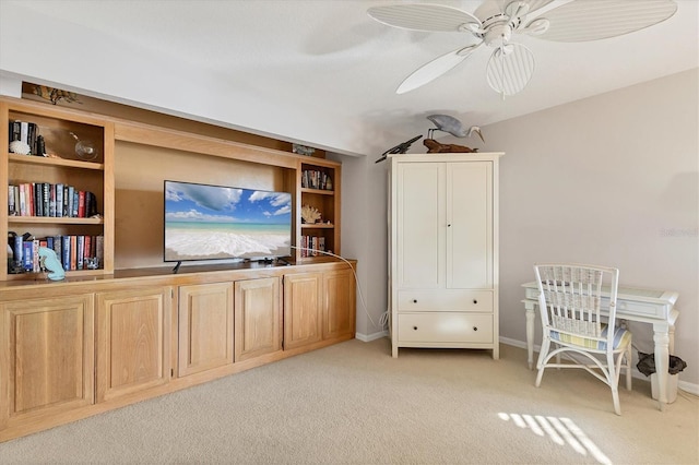 office space featuring ceiling fan and light colored carpet