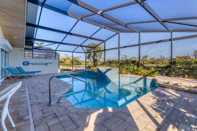 view of pool featuring a patio and glass enclosure