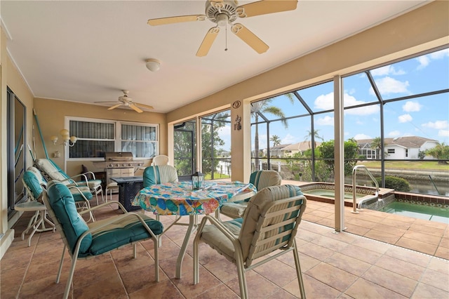 sunroom / solarium featuring ceiling fan and a pool