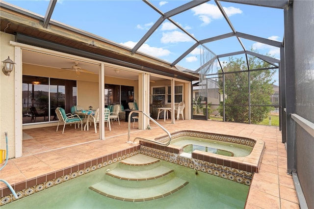 view of swimming pool featuring an in ground hot tub, a lanai, and a patio