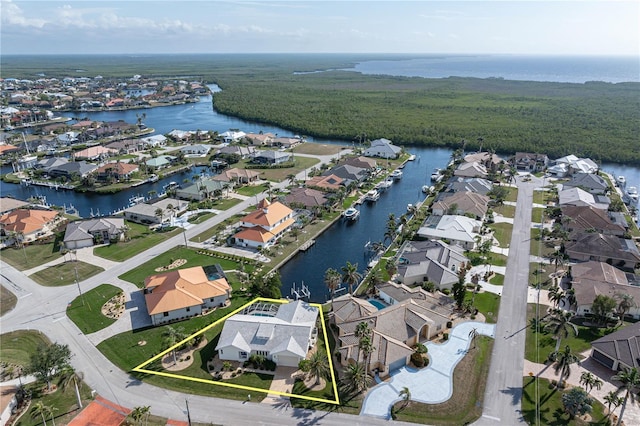 birds eye view of property with a water view