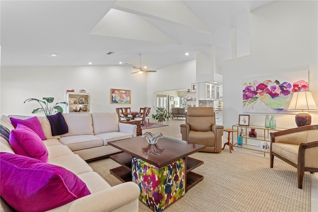 carpeted living room featuring high vaulted ceiling