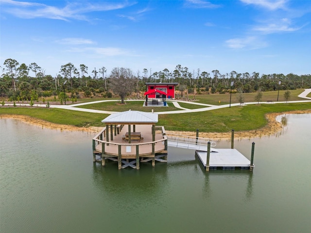 view of dock with a gazebo, a water view, and a yard