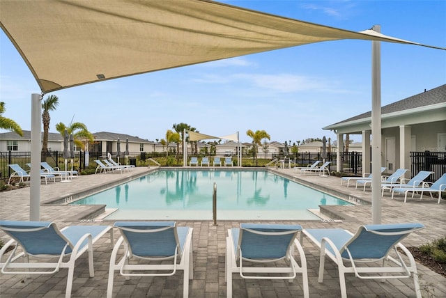 view of swimming pool with a patio