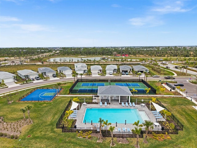 birds eye view of property with a water view