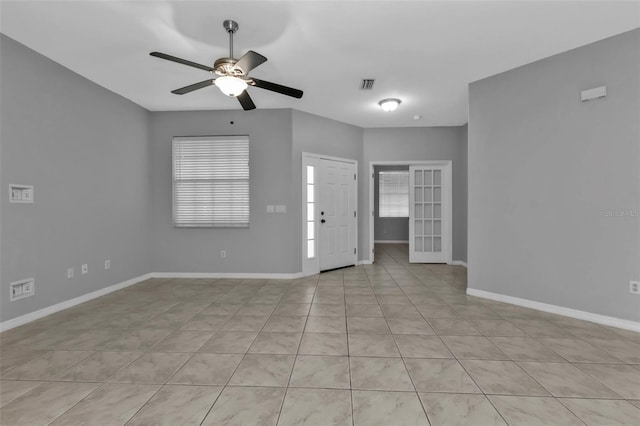 interior space featuring ceiling fan