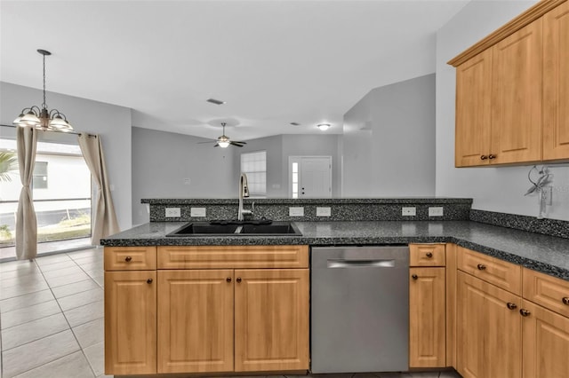 kitchen featuring light tile patterned floors, dishwasher, sink, and ceiling fan with notable chandelier