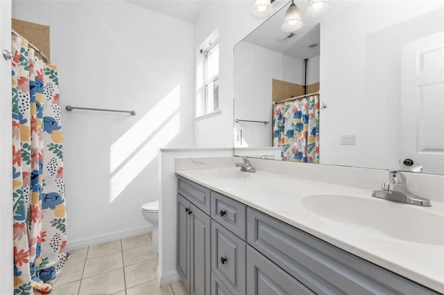 bathroom with toilet, vanity, a shower with curtain, and tile patterned floors