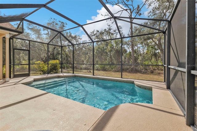 view of pool featuring a lanai and a patio area