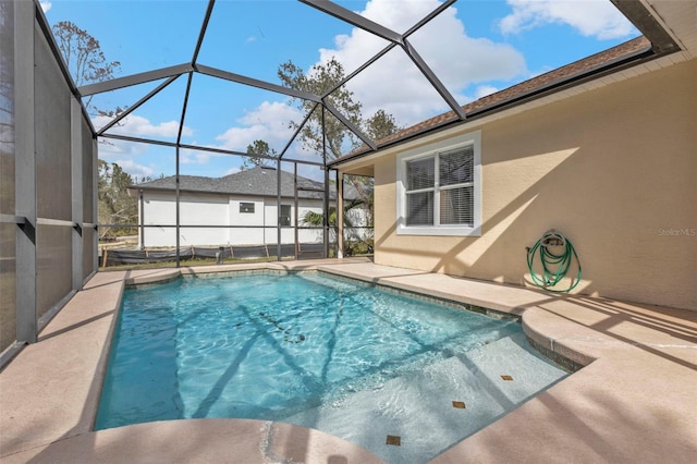 view of pool featuring a lanai and a patio area