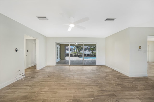 unfurnished room with ceiling fan