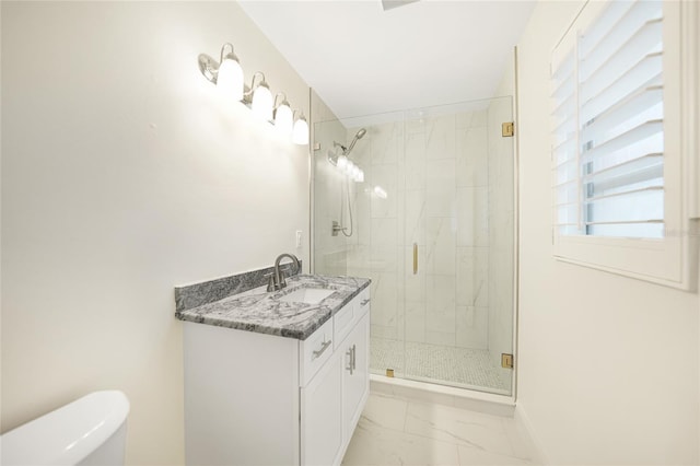 bathroom featuring vanity, toilet, and an enclosed shower