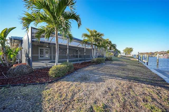 exterior space featuring a lanai and a boat dock