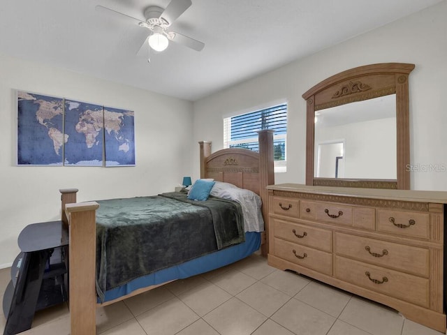 bedroom with ceiling fan and light tile patterned floors