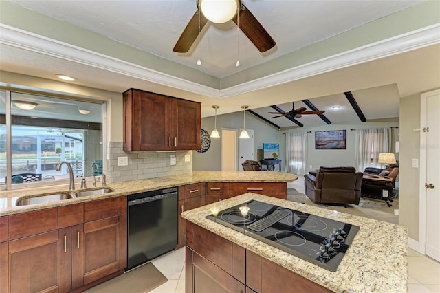 kitchen featuring light tile patterned flooring, pendant lighting, sink, backsplash, and black appliances