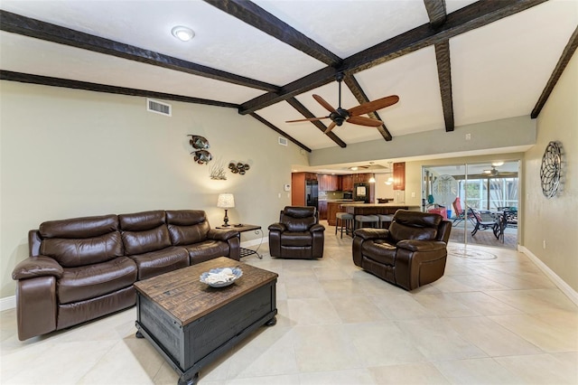 living room featuring vaulted ceiling with beams, light tile patterned floors, and ceiling fan