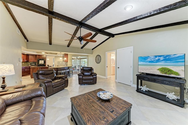 living room with ceiling fan and lofted ceiling with beams